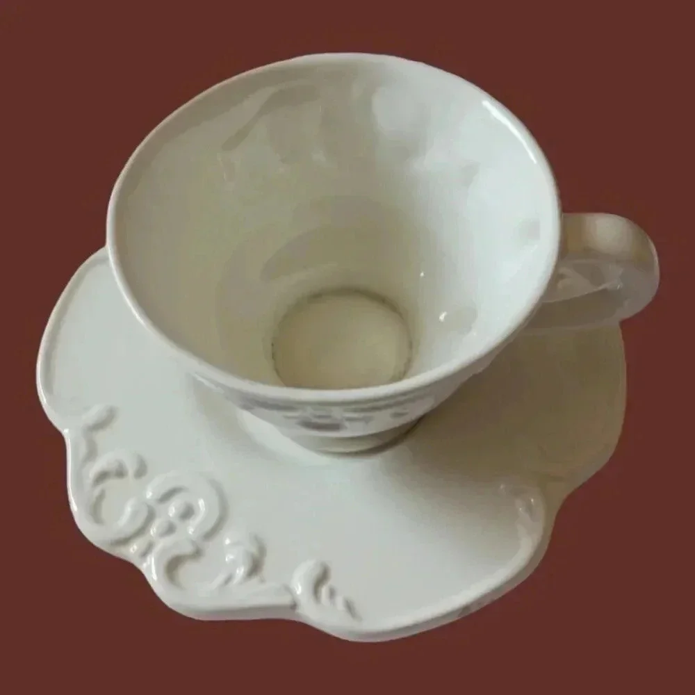 Shabby chic porcelain teacup and saucer